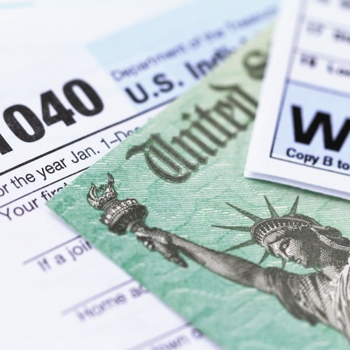 partial photo of a 1040 tax document, W2 tax document, and a treasury bill